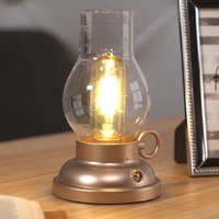 Globo Eastern Europe s.r.o Érintőkapcsolós asztali LED lámpa, tölthető, petróleum lámpa hatású, pezsgőszínű - Petro Globo 58016CH - szabályozható fényerősség, 2700 K, 65 lm, 1 W, 1 méteres kábel, akkumulátoros