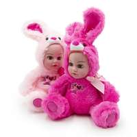 Netshop Síró, nevető, beszélő baba óriás szempillával - plüss anyagú nyuszis jelmezben