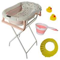 Kidscare Összecsukható rózsaszín babakád fém vázzal KidsCare, hőmérővel, szűkítő párnával, játékokkal, fejvédővel, összecsukható csészével